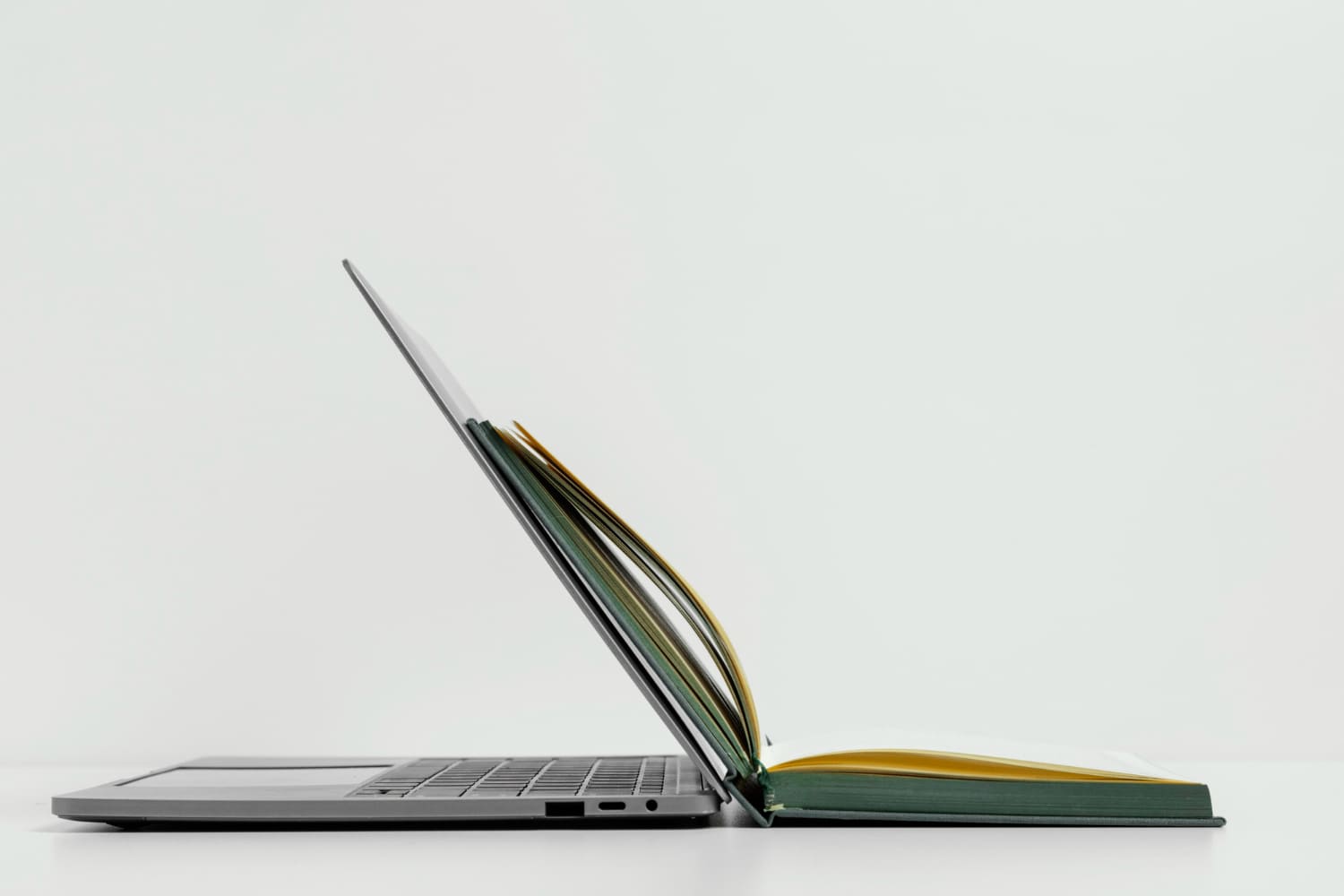 Laptop and study book for choosing an Acer laptop in Malaysia