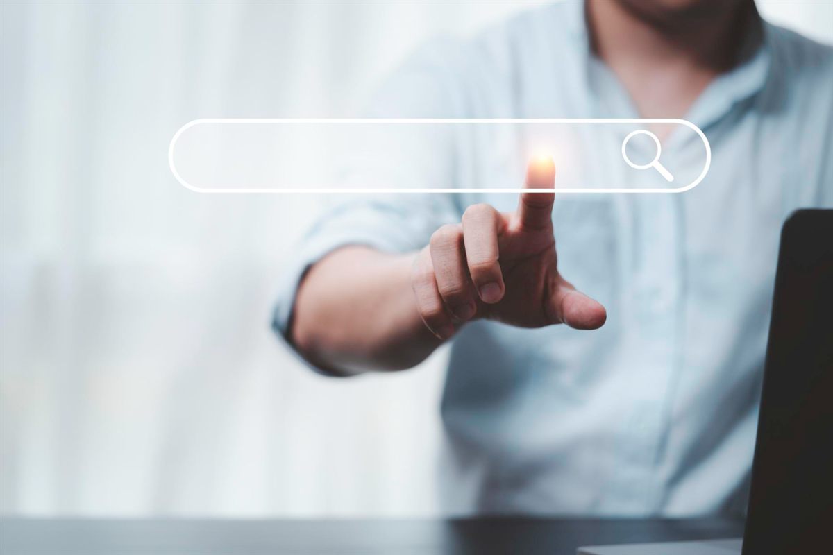Person reaching towards a floating search bar illustration