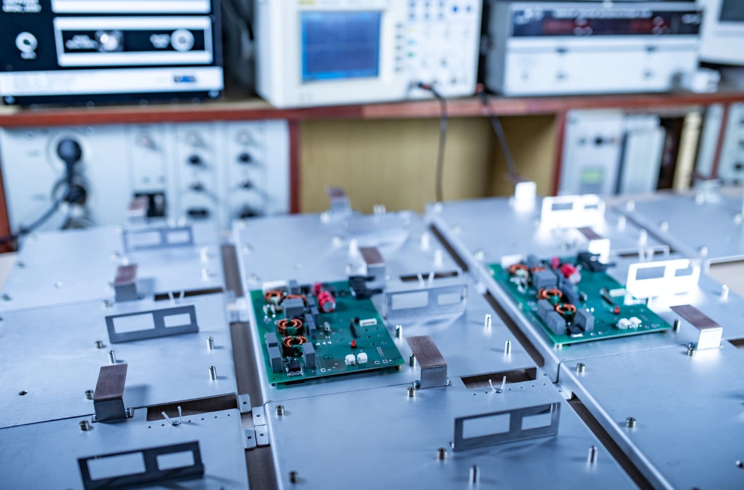 Circuit boards moving between electronics testing workstations